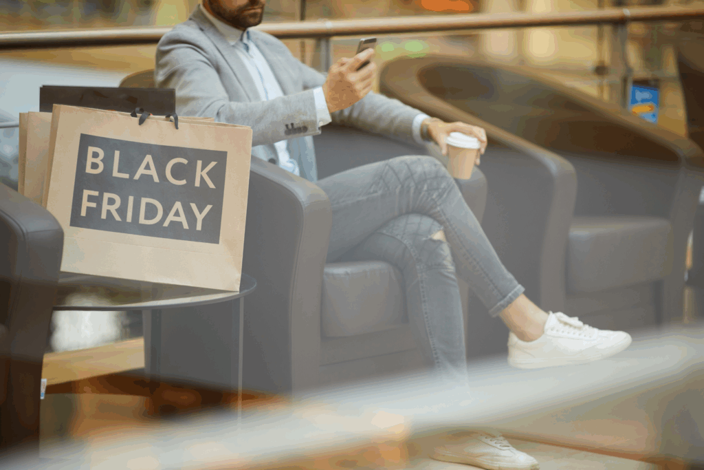 Business owners reviewing sales data and planning Black Friday strategies to improve cash flow.